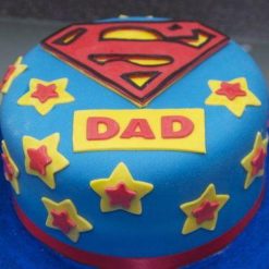 Awesome Super Dad Cake - Adorned with fondant decorations featuring superhero emblems or a personalized message