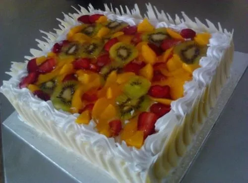 Premium Fruit Burst Cake - Moist cake with creamy frosting and a vibrant assortment of premium fruits, perfect for any celebration