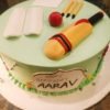 Cricket Lover's Cake with cricket-themed decorations and cricket bat and ball