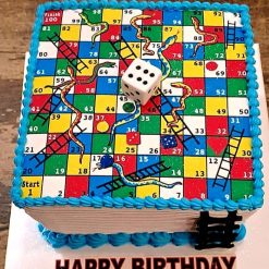 Snake & Ladder Theme Cake with colorful board design and edible game pieces