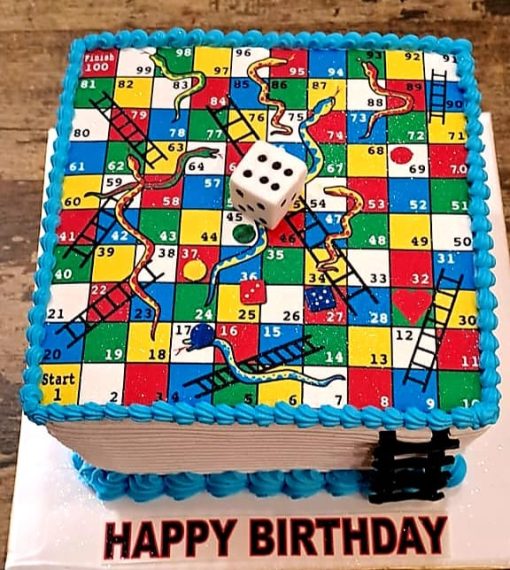 Snake & Ladder Theme Cake with colorful board design and edible game pieces